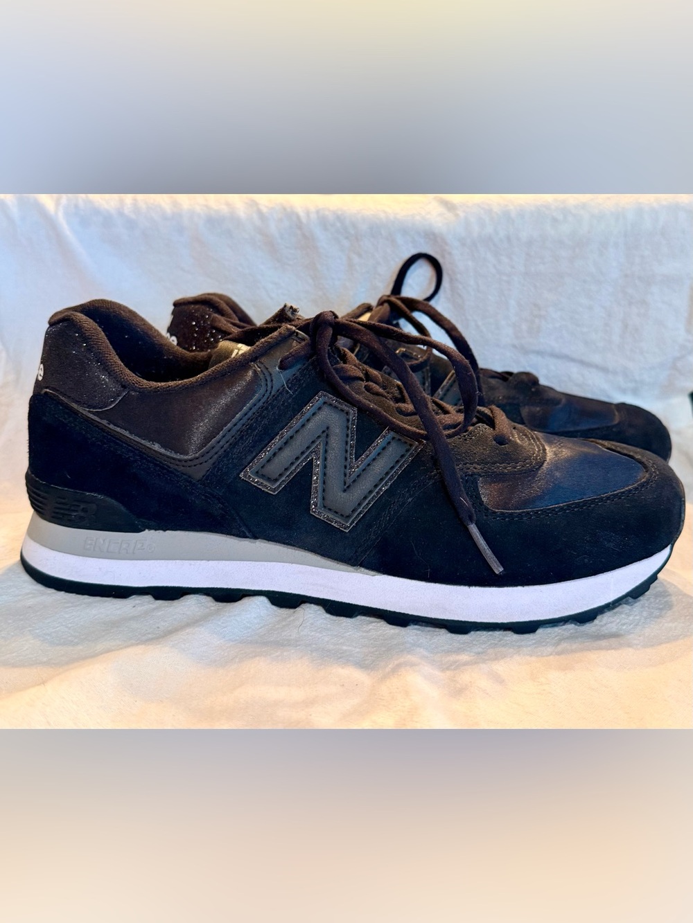 New Balance women’s 574 Black Suede Casual Sneaker